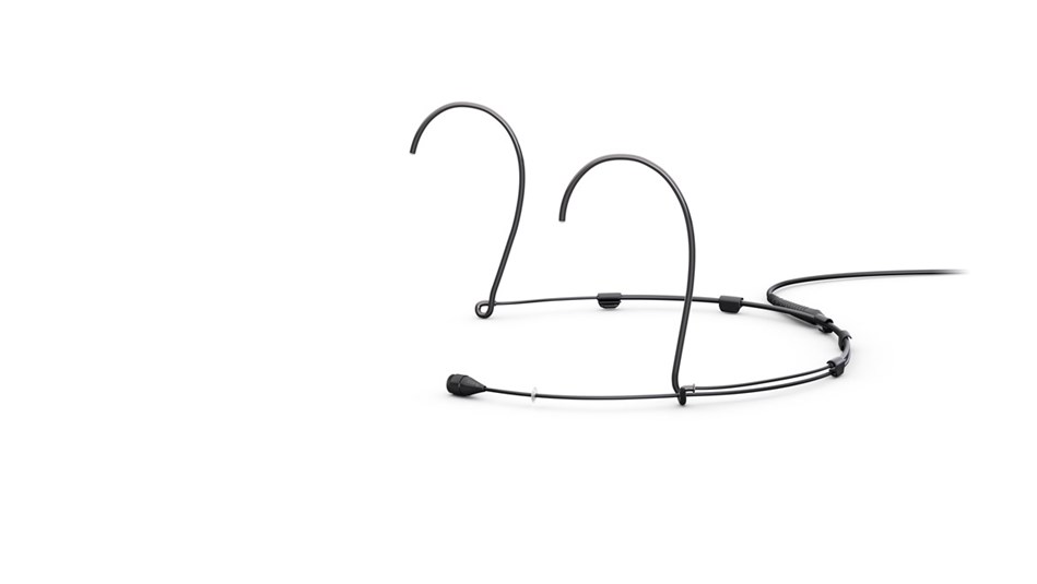 Black stethoscope with dual earpieces resting on a white background, tubing curve visible.